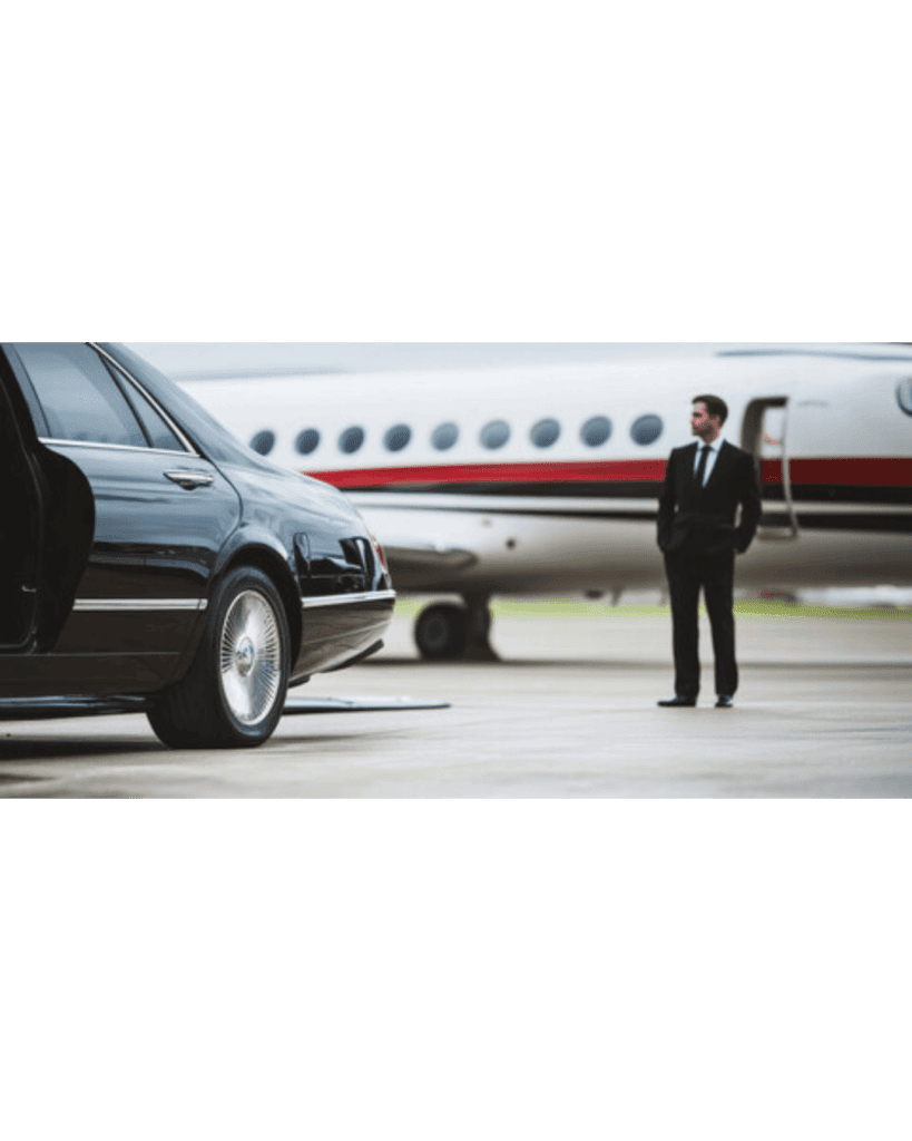 Luxury Umrah taxi service with chauffeur helping pilgrim in ihram at Jeddah Airport